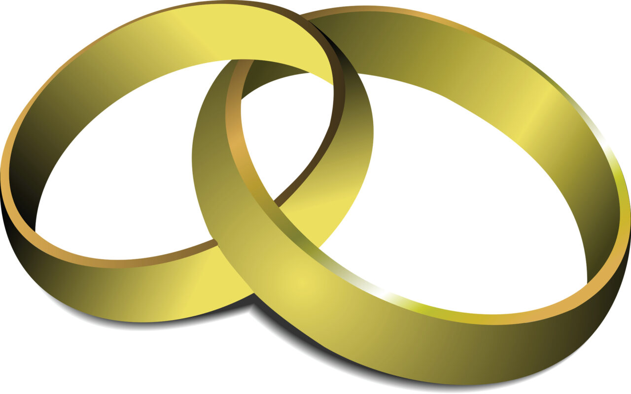 Two interlocking gold rings, symbolizing commitment or eternity on a white background.