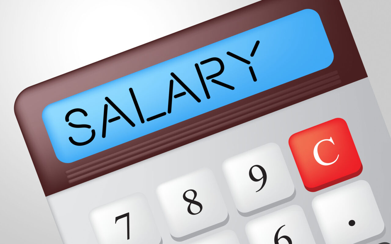 Calculator with a blue display reading SALARY!, numeric keypad visible in the foreground