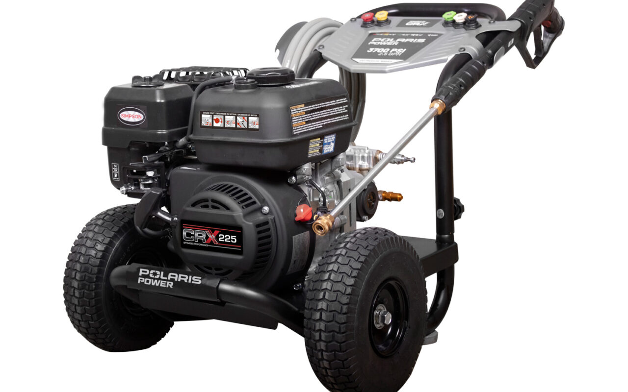 Gas-powered pressure washer on a wheeled cart with a coiled hose and a trigger wand, ready for cleaning jobs.